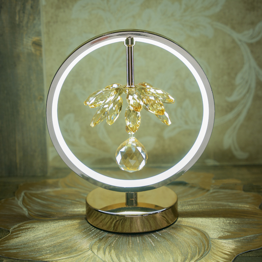 Decorative lamp with crystal design on a reflective surface