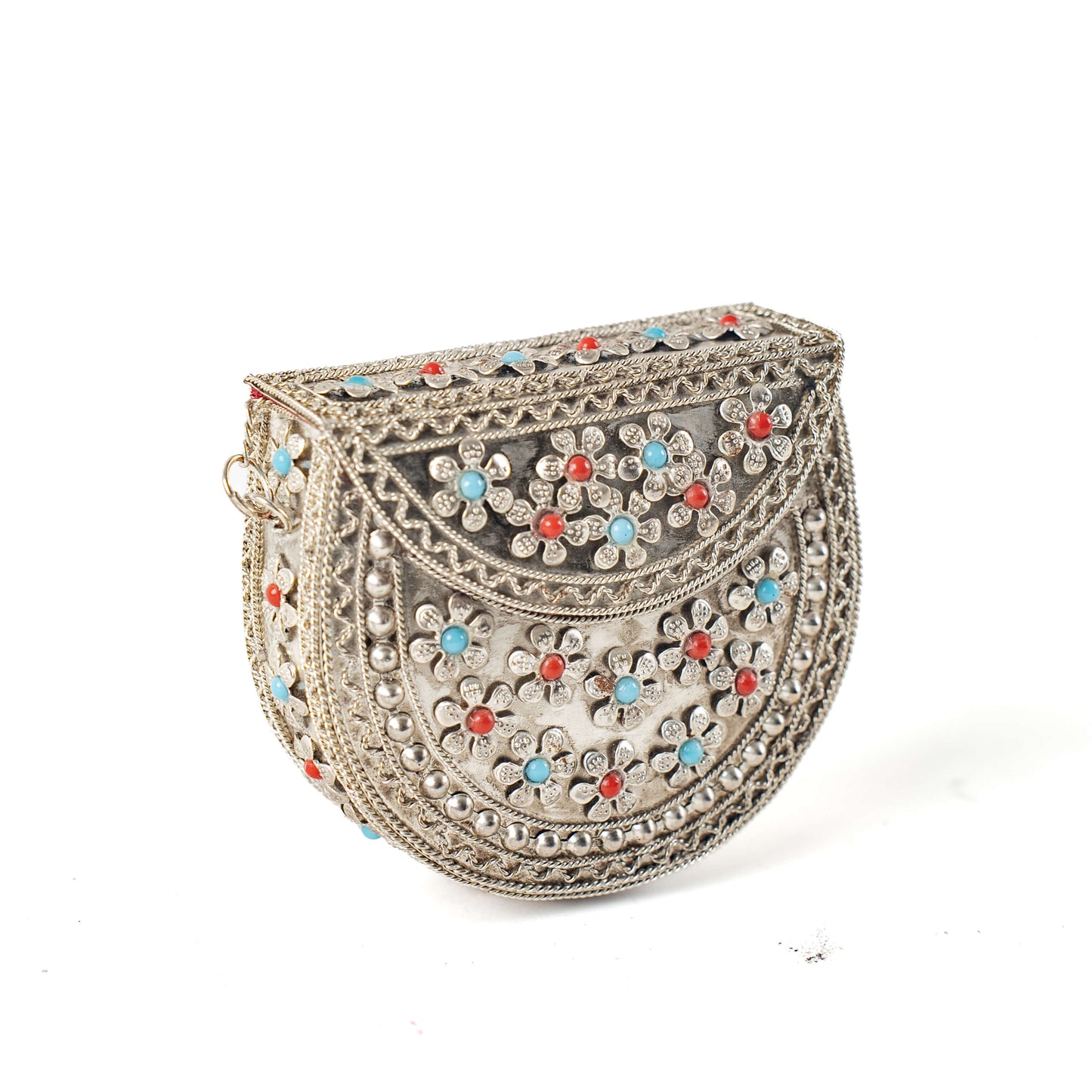 Decorative handbag with floral patterns and colorful stones on a white background